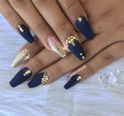 navy blue nails with gold.